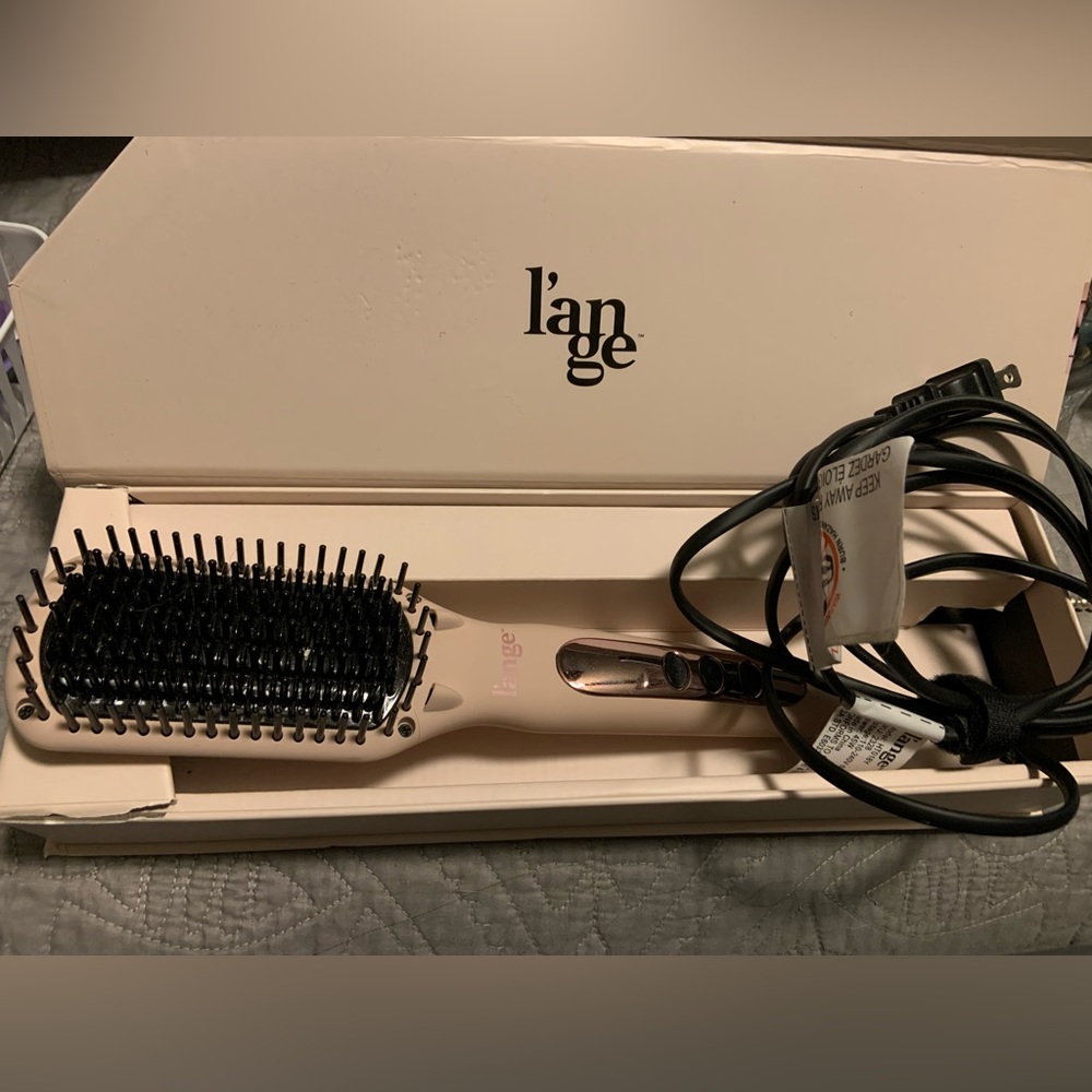 Lange ceramic hairbrush. Like new. Only used a few times.